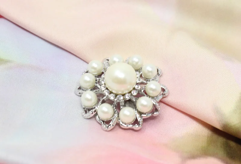 Silver pearl brooch